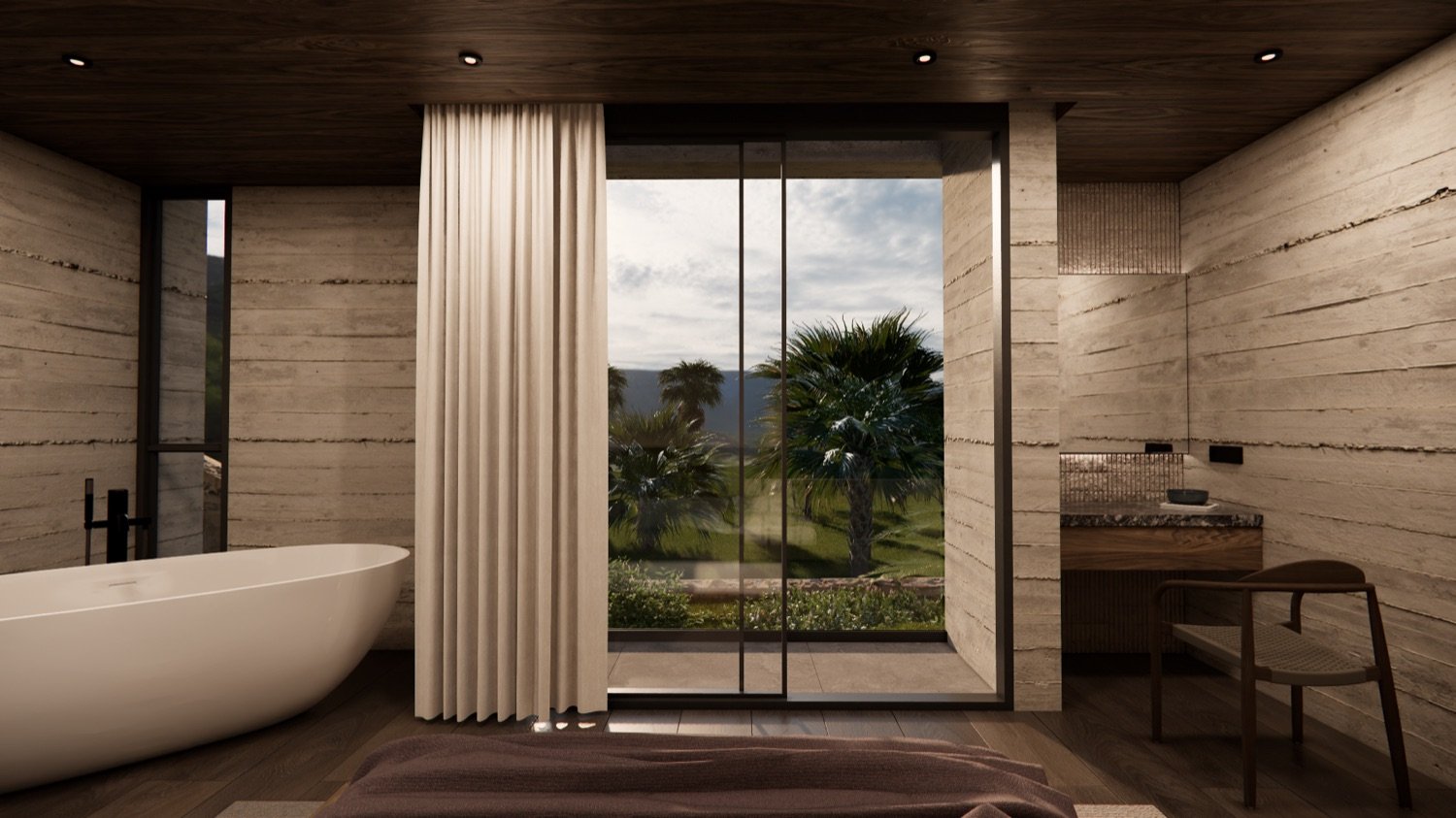 Master ensuite with a freestanding tub, timber ceiling and travertine walls, opening to palms and distant hills.